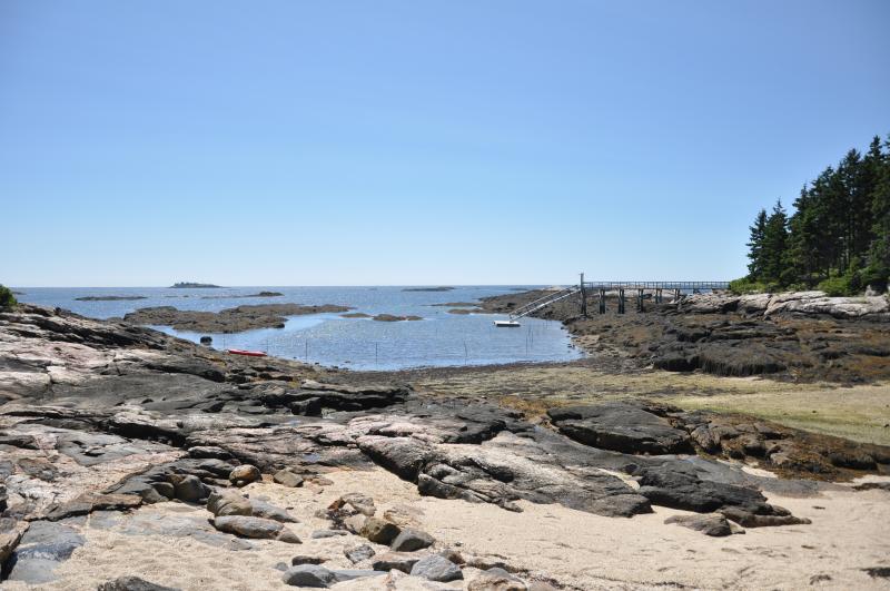 South Beach on Pratts Island was a popular spot August 15, but not because of the weather. More than 50 people were present to hear about a proposed project that would dredge a section of the water to allow for all-tide access. BEN BULKELEY/Boothbay Register